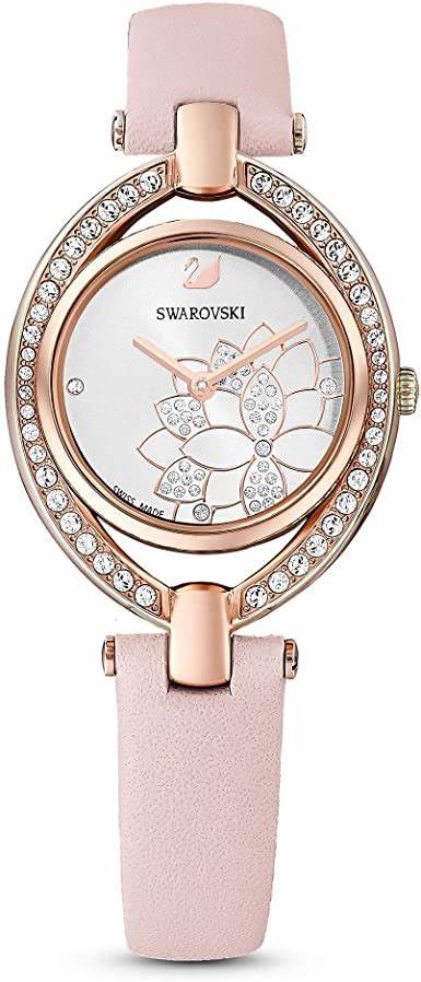 Its rose gold-tone coated stainless steel case is finished with the faceted crystal bezel exclusive to Swarovski watches, which gleams in light pink tones to match the pink sunray dial and pink genuine leather strap. Case: 28 mm.  Swiss Made.